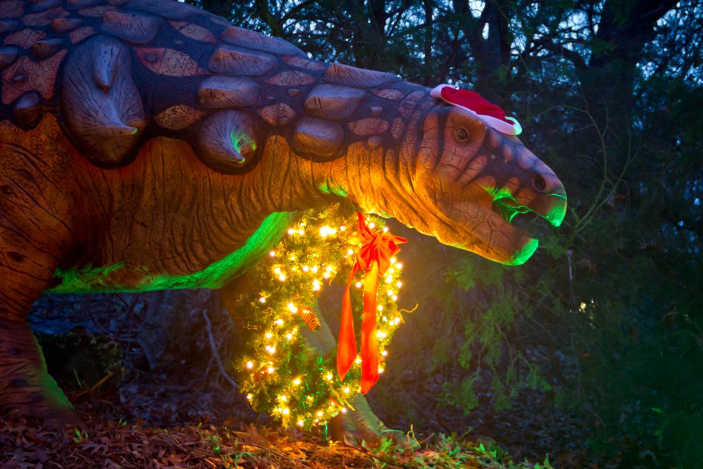 dinosaur with a christmas wreath