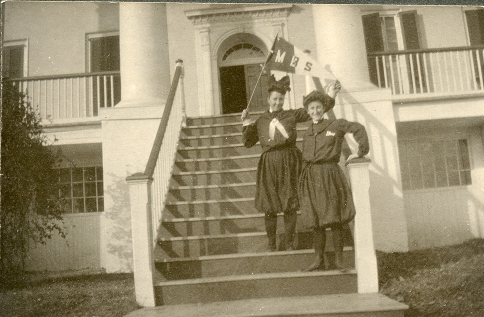 Bessie Heard with another woman on the steps to a large building