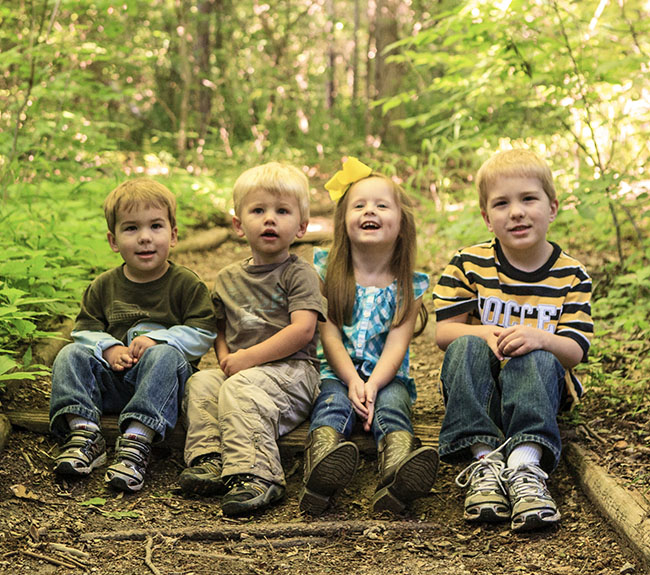 Children sitting on trail