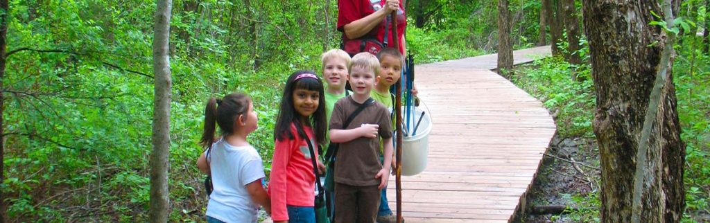 group of children walking the Heard